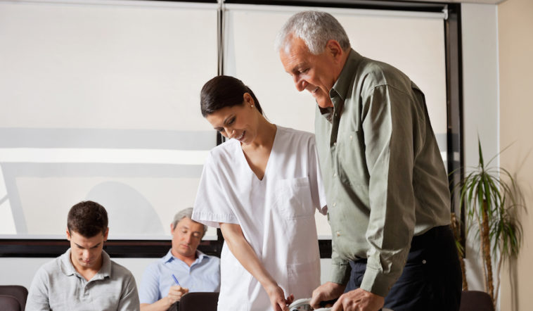 Picture of Physical Therapist Helping a Patient