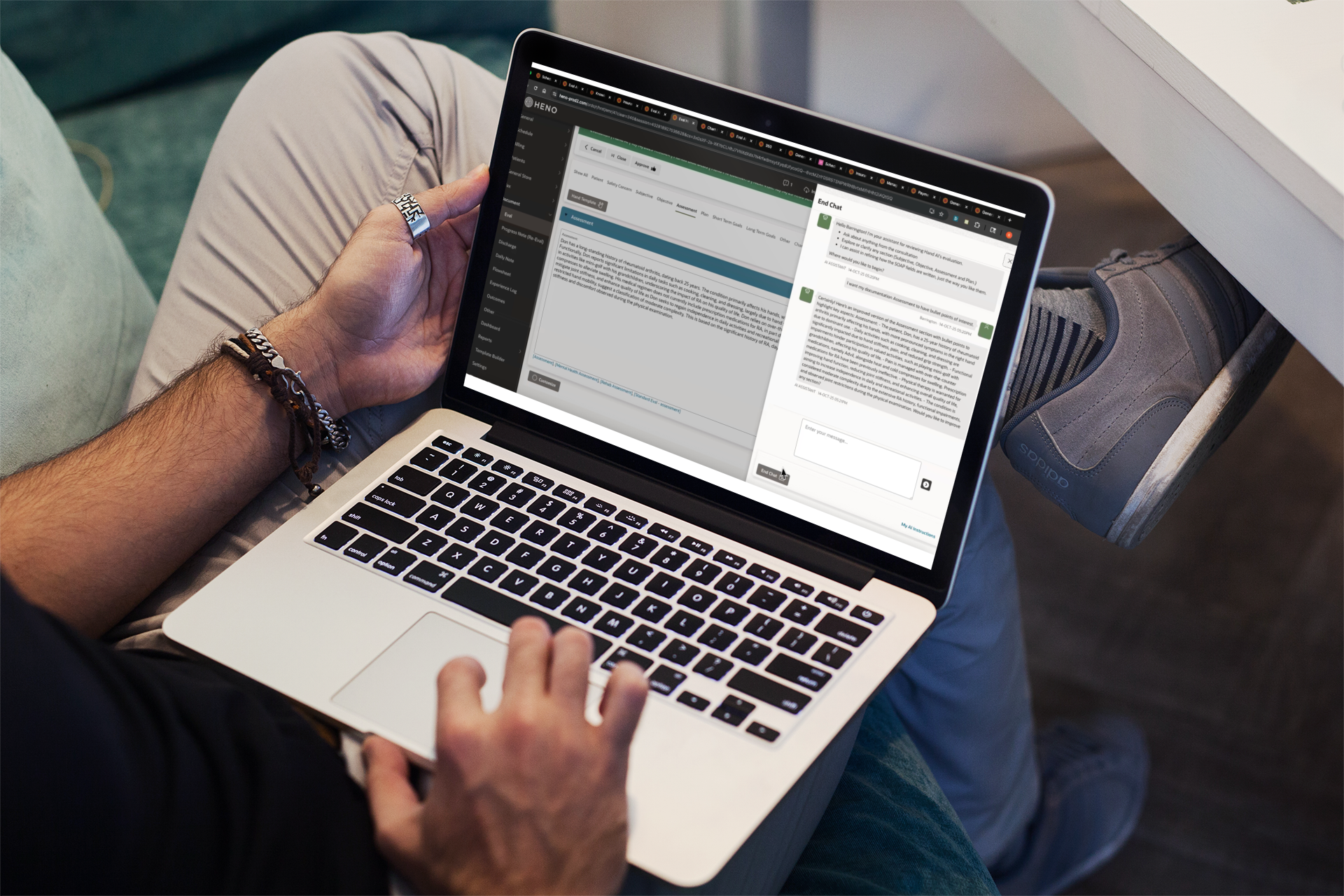 Person sitting on a couch using a laptop, exploring the HENO AI Scribe features filled with text fields and menu options on the screen.